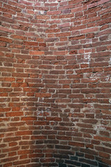 fragment of old red brick wall