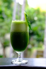 healthy kale smoothie on wood table