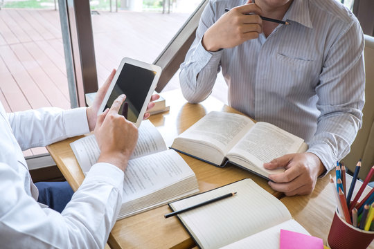 Tutor, learning, education, Group of teenager learning studying new lesson to knowledge in library during helping teaching friend education prepare for exam, youth campus friendship teens concept
