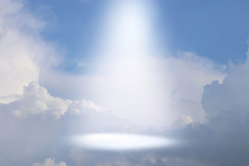 Naklejka na ściany i meble A picture of a celestial ray of light in the sky. Concept of religion and faith