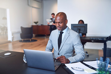African American businessman working online in a modern office