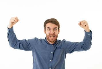 Portrait of surprised and happy man celebrating victory goal or winning lottery in human emotions