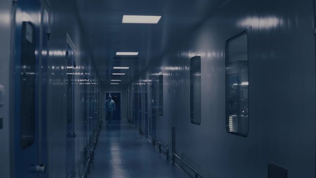 Factory white corridor. Long corridor with doors. Chemical Laboratory. Industrial factory interior. Pharmaceutical facility and technology equipment.