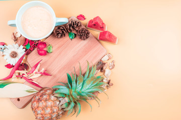 Obraz na płótnie Canvas web banner freshness fruit and drink in summer season concept from minimal flat lay diet food with decorate by pineapple watermelon and tropical flower lay on pastel yellow background