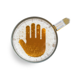 Sign stop gesture on the beer foam in glass isolated on white background. Top view