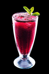 Fresh berries cocktail with raspberry, blackberry, mint and ice in glass on black isolated background
