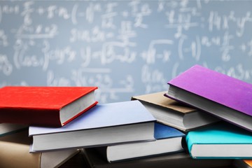 Stack of books on background