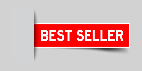 Label sticker red color in word best seller that inserted in gray background