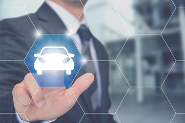 車のアイコンを押すビジネスマン Touching car vehicle icon