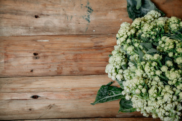Cauliflower lies on planed boards