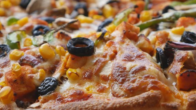 A close up view of pizza with vegetables.