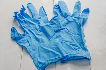 blue disposable gloves on white
