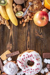 Unhealthy and healthy sweets. Problem of refusal from harmful desserts. Fruits and nuts vs donuts cupcakes and candy