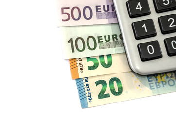 euro banknotes and calculator on white background