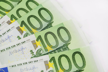 100 euro banknotes on a white background
