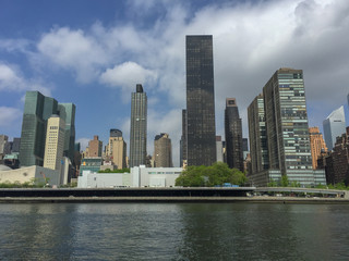 Fototapeta na wymiar Building Riverside with blue sky background, New York City. Cityscape Concept.