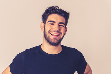 Obraz premium Human expressions and emotions. Joyful young attractive man smiling with happy face