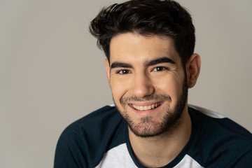 Fashion portrait of Attractive young manly man model posing happy and sexy for the camera