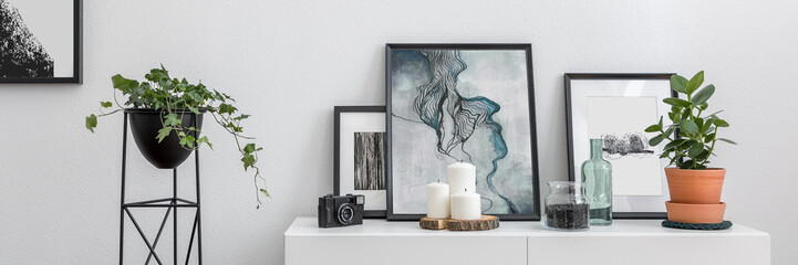 White sideboard and flower stand