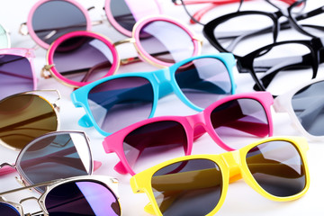 Colorful sunglasses on white background