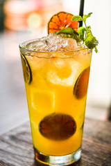 Vodka or rum with homemade falernum, ginger beer and passionfruit in a tall glass