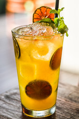 Vodka or rum with homemade falernum, ginger beer and passionfruit in a tall glass