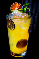 Vodka or rum with homemade falernum, ginger beer and passionfruit in a tall glass
