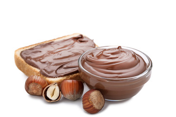 Melted chocolate with hazelnuts and bread isolated on white background
