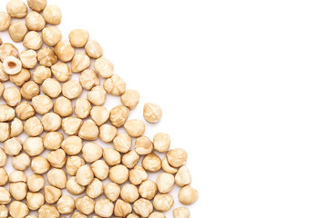 Peeled hazelnuts on isolated white background