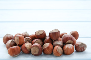 Ripe hazelnuts on wooden table