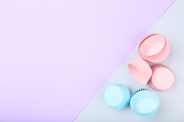 Cupcake cases on colorful background