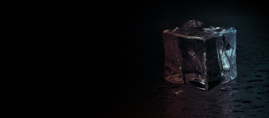 ice cube on dark background, panoramic image