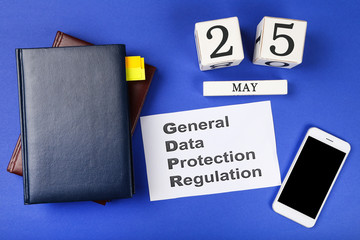 General Data Protection Regulation, GDPR with notepads, smartphone and cube calendar