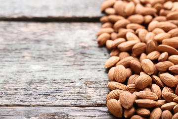 Almonds on grey wooden table