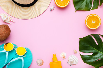 Fashion clothing with seashells, green leafs and fruits on pink background