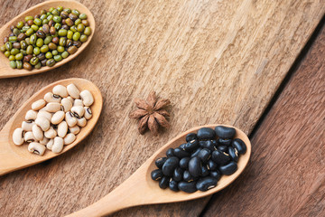 Health food and Eat healthy with legumes in wooden spoon on wooden table. Nutrition high protein diet.