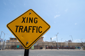 Sign for Crossing (XING) traffic, warning drivers
