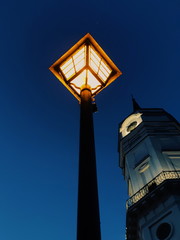 Fototapeta na wymiar old street lamp on the background of blue sky