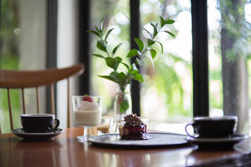 Bakery and cake with Espresso black coffee on the table.