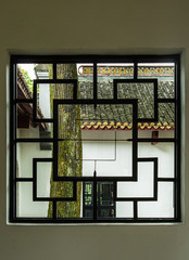 Chinese traditional style wood window in green garden