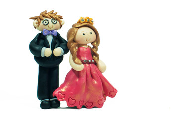 Fototapeta premium Handmade clay doll for a bride and groom