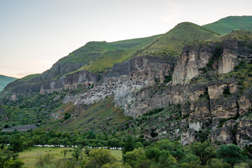 Fototapeta na wymiar View of Vardzia caves. Vardzia is a cave monastery site in southern Georgia, excavated from the slopes of the Erusheti Mountain on the left bank of the Kura River.