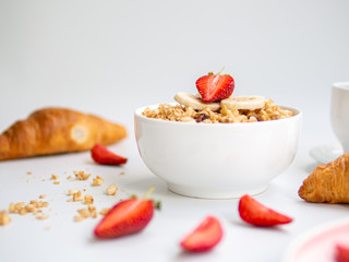 English breakfast, croissants with oatmeal porridge and fruits in a bowl - healthy breakfast