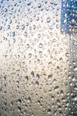 background of raindrops on window glass, close up
