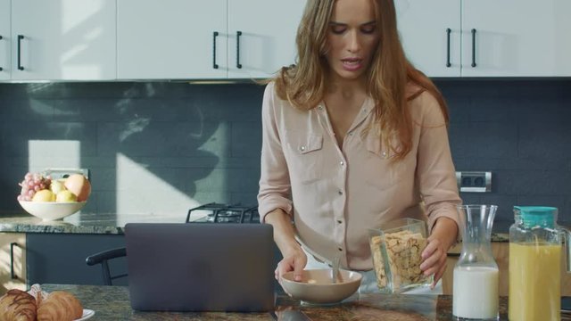 Business woman preparing breakfast in a hurry. Closeup mother running to work.