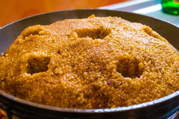 Preparation of Uzbek pilaf - evaporation of water from rice, close up