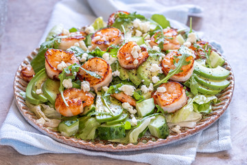 salad with shrimps, avocado, cucumber and feta cheese