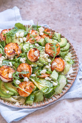 salad with shrimps, avocado, cucumber and feta cheese