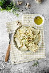 Dumplings, filled with mushrooms Champignon. Russian, Ukrainian or Polish dish: varenyky, vareniki, pierogi, pyrohy. Food photo. flat lay composition