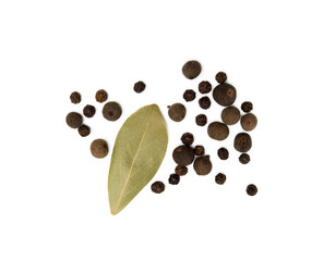 Bay leaf, allspice and pepper isolated on white background